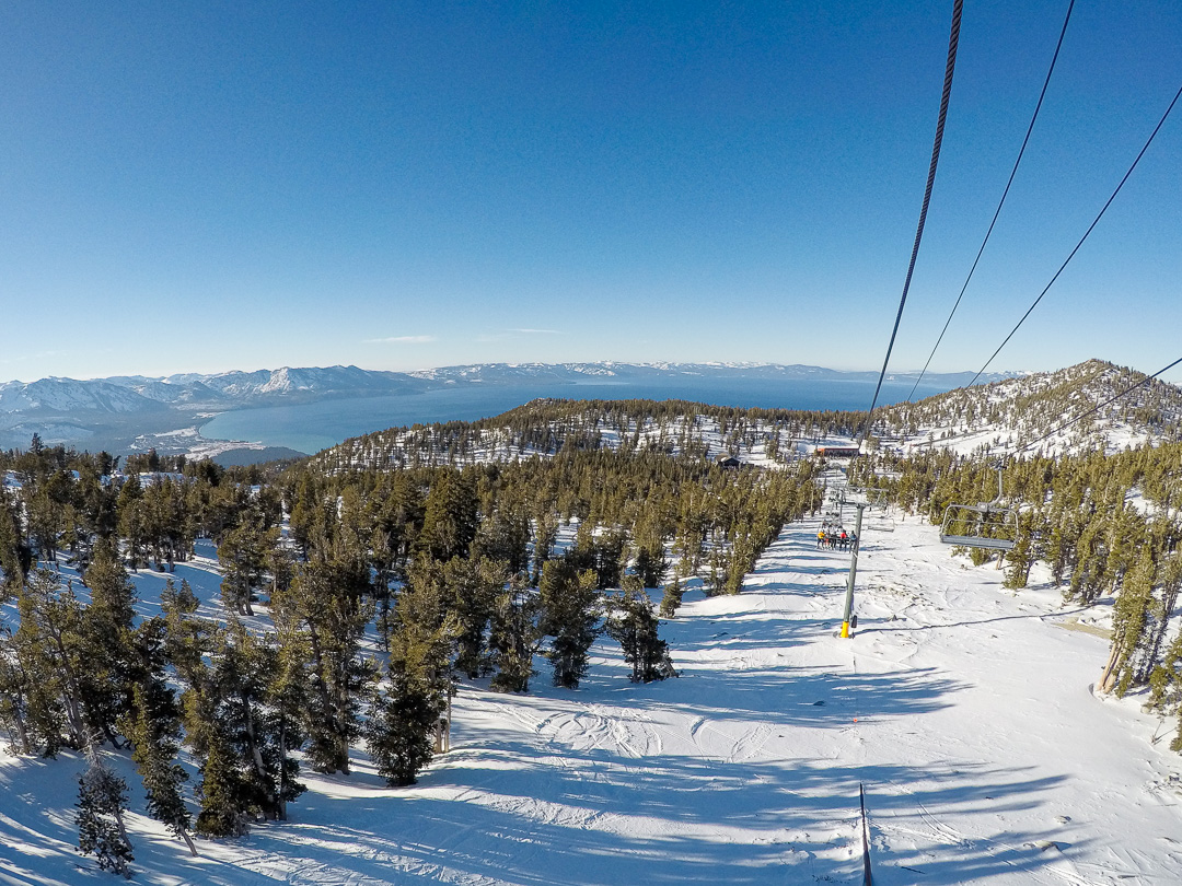 view of lake tahoe from a ski lift at heavenly in winter