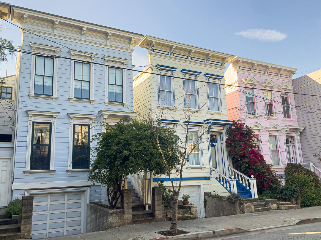 historic pastel colored houses on Lexington Street in San Francisco in the Liberty Hill Historic District, walk this street on the Mission burrito walking tour